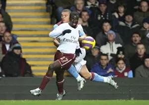 Images Dated 3rd December 2007: Emmanuel Eboue (Arsenal) Wilfred Bouma (Aston Villa)