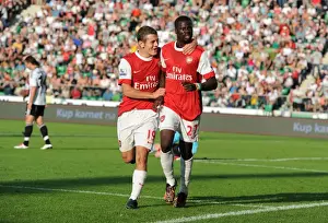Legia Warsaw V Arsenal 2010-11 Prints: Emmanuel Eboue celebrates scoring the 3rd Arsenal goal with Jack Wilshere