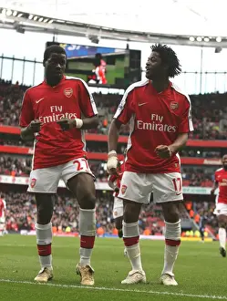 Emmanuel Eboue celebrates scoring the 4th Arsenal goal with Alex Song