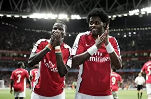 Emmanuel Eboue celebrates scoring Arsenals 2nd goal with Alex Song
