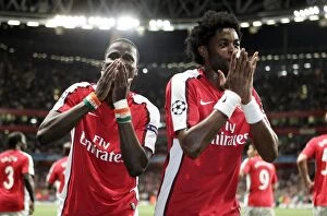 Song Alexandre Collection: Emmanuel Eboue celebrates scoring Arsenals 2nd goal with Alex Song