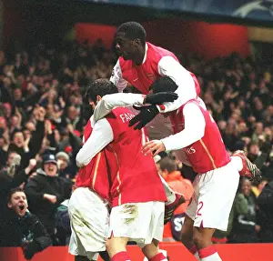 Emmanuel Eboue celebrates scoring Arsenals 2nd goal with Cesc Fabregas