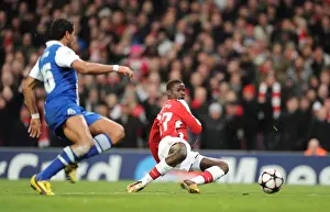 Arsenal V FC Porto 2009-10 Prints: Emmanuel Eboue goes past Porto goalkeeper Helton to score the 4th Arsenal goal