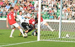 Legia Warsaw V Arsenal 2010-11 Prints: Emmanuel Eboue heads past Ariel Borysiuk to score the 2nd Arsenal goal