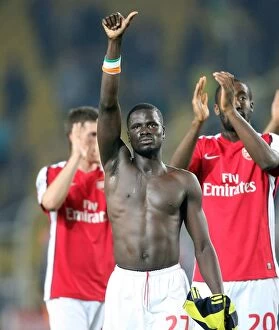 Eboue Emmanuel Collection: Emmanuel Eboue's Victory Thumbs-Up: Arsenal's 5-2 Win Over Fenerbahce in Champions League