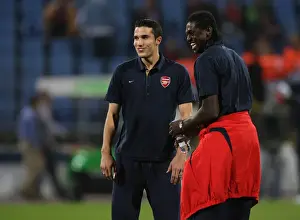Emmauel Adebayor and Robin van Persie (Arsenal) share a joke
