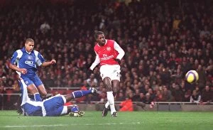 Arsenal v Portsmouth 2006-07 Collection: Emmauel Adebayor scores Arsenals 1st goal under pressure from Linvoy Primus
