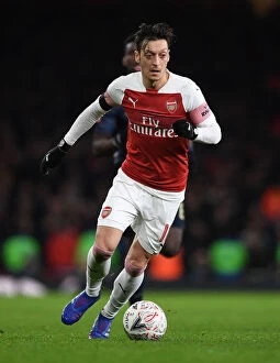 Arsenal v Manchester United FA Cup 2018-19 Collection: FA Cup Showdown: Arsenal vs Manchester United - Ozil's Leadership: A Battle of Football Giants