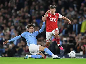 Manchester City V Arsenal 2022-23 Prints: FA Cup Showdown: Trossard vs Stones - A Battle of Champions at Etihad Stadium (2022-23)