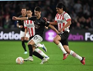 PSV Eindhoven v Arsenal 2022-23 Collection: Fabio Vieira Breaks Past PSV's Erick Gutierrez in Arsenal's UEFA Europa League Clash
