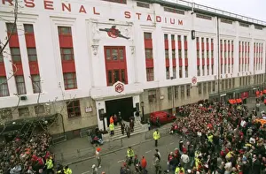 Fans gather outside the East Stand on Avenell Road to watch the Arsenal team arrive at the stadium