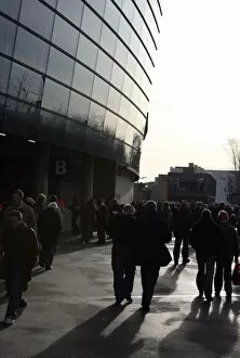 Fans walk around the stadium