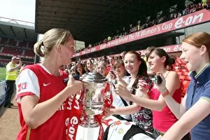 Images Dated 6th May 2008: Faye White (Arsenal) shows of the troph to the fans