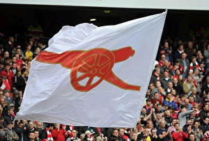 Arsenal V Norwich City 2013-14 Prints: A flag is waved before the match. Arsenal 4: 1 Norwich City. Barclays Premier League