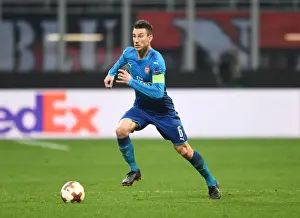 AC Milan V Arsenal 2017-18 Prints: Focused Koscielny: Arsenal's Defensive Hero in Europa League Clash Against AC Milan
