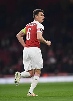 Images Dated 13th December 2018: Focused Koscielny: Arsenal's Unyielding Defender in Europa League Battle Against Qarabag