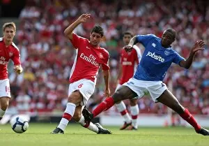 Images Dated 22nd August 2009: Fran Merida (Arsenal) Aaron Mokoena (Portsmouth)