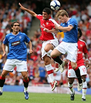 Arsenal V Rangers 2009-10 Prints: Fran Merida (Arsenal) Steven Davis (Rangers)