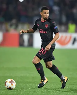 Red Star Belgrade V Arsenal 2017-18 Prints: Francis Coquelin: Arsenal's Midfield Maestro Shines in Europa League Battle against Red Star Belgrade