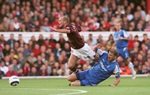 Images Dated 2nd October 2005: Freddie Ljungberg (Arsenal) is fouled by Kenny Cunningham (Birmingham) leading to Cunnigham being se