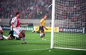 Freddie Ljungberg chips the ball over Ajax goalkeeper Hans Vonk to score the 1st Arsenal goal