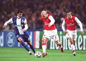 Images Dated 7th December 2006: Freddie Ljungberg and Gael Clichy (Arsenal) Lucho Gonzalez (Porto)