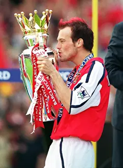 Fredrik Ljungberg kisses the F. A. Barclaycard Premiership Trophy
