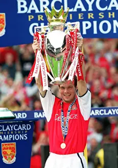 Fredrik Ljungberg lifts the F. A. Barclaycard Premiership Trophy