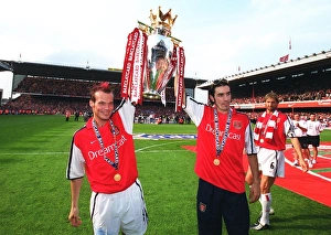 Fredrik Ljungberg and Robert Pires (Arsenal) lift the F. A