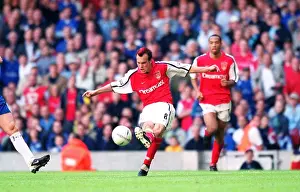 Fredrik Ljungberg shoots past Chelsea goalkeeper Carlo Cudicini to score the 2nd Arsenal goal