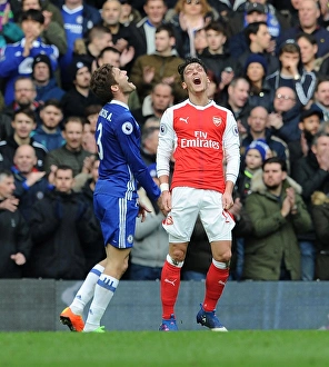 Chelsea V Arsenal 2016-17 Prints: Frustration and Rivalry: Ozil vs. Alonso in the Chelsea vs. Arsenal Premier League Clash