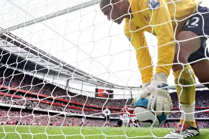 Fulham goalkeeper Tony Warner picks the ball out of the net after Robin van Persies penalty