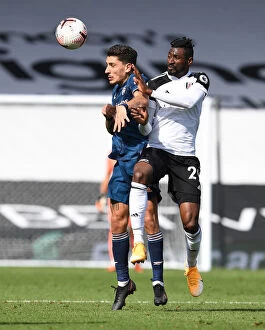 Images Dated 12th September 2020: Fulham vs Arsenal: Hector Bellerin Clashes with Andre-Frank Anguissa in Premier League Showdown