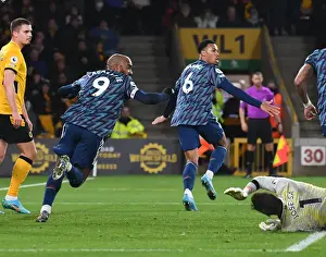Gabriel and Lacazette Celebrate Arsenal's Goal Against Wolverhampton Wanderers in Premier League Match