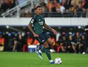 RC Lens V Arsenal 2023-24 Prints: Gabriel Magalhaes: Arsenal's Defensive Powerhouse in UEFA Champions League Clash Against RC Lens (2023/24)