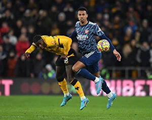 Images Dated 10th February 2022: Gabriel Magalhaes vs. Francisco Trincao: Intense Clash Between Wolverhampton Wanderers