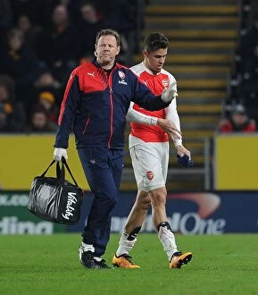 Images Dated 8th March 2016: Gabriel Receives Medical Attention from Arsenal Physio Colin Lewin during FA Cup Match against