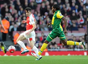 Gabriel Stands Firm: Arsenal's Defender Fends Off Norwich's Mbokani