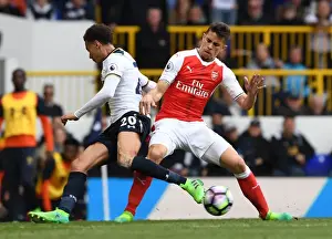 Tottenham Hotspur V Arsenal 2016-17 Prints: Gabriel vs Dele Alli: Intense Tackle in the Premier League Showdown between Arsenal and Tottenham