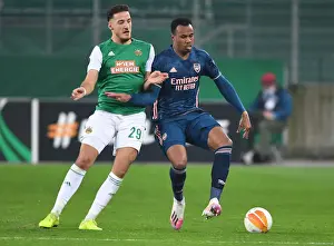 Rapid Vienna V Arsenal 2020-21 Prints: Gabriel vs. Kara: Clash in the Europa League: Rapid Vienna vs. Arsenal