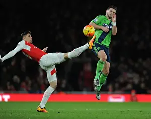 Arsenal V Southampton 2015-16 Prints: Gabriel vs. Long: A Premier League Showdown at Emirates Stadium