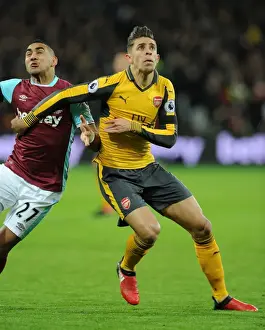 West Ham United V Arsenal 2016-17 Prints: Gabriel vs Payet: Intense Clash Between West Ham and Arsenal in Premier League