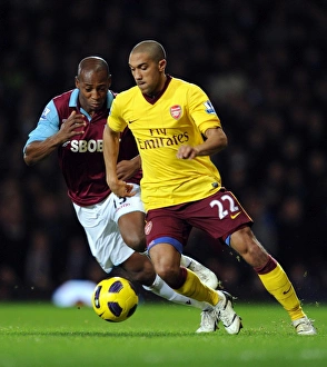 West Ham United v Arsenal 2010-11 Collection: Gael Clichy (Arsenal) Luis Boa Morte (West Ham). West Ham United 0: 3 Arsenal