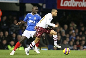 Portsmouth v Arsenal Gallery: Gael Clichy (Arsenal) Papa Boupa Diop (Portsmouth)