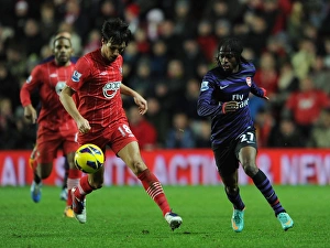 Southampton v Arsenal 2012-13 Collection: Gervinho (Arsenal) Jack Cork (Southampton). Southampton 1: 1 Arsenal. Barclays Premier League
