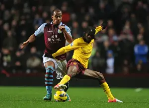 Aston Villa V Arsenal 2012-13 Prints: Gervinho vs Agbonlahor: Intense Battle in Aston Villa vs Arsenal Premier League Clash