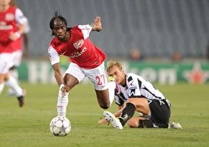Images Dated 24th August 2011: Gervinho vs. Ekstrand: Arsenal's Edge in Udinese Clash (2011-12)