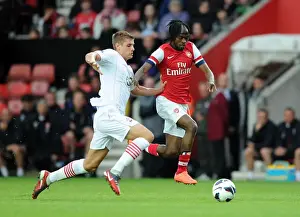 Southampton V Arsenal 2012-13 - Pre Season Prints: Gervinho vs. Jack Stephens: Clash in the 2012-13 Southampton vs. Arsenal Pre-Season Match