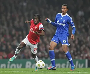 Arsenal V Schalke 04 2012-13 Prints: Gervinho vs. Joel Matip: Battle at the Emirates - Arsenal FC vs