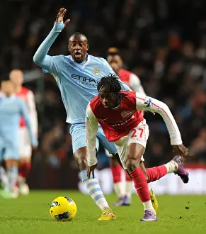 Manchester City V Arsenal 2011-12 Prints: Gervinho vs Yaya Toure: Battle at Etihad Stadium - Manchester City vs Arsenal